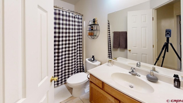 bathroom with vanity, tile patterned floors, and toilet