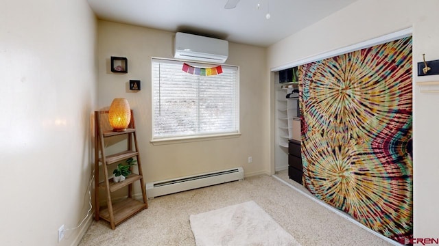 interior space with ceiling fan, an AC wall unit, light colored carpet, and a baseboard heating unit