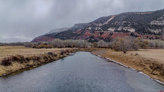 mountain view featuring a water view