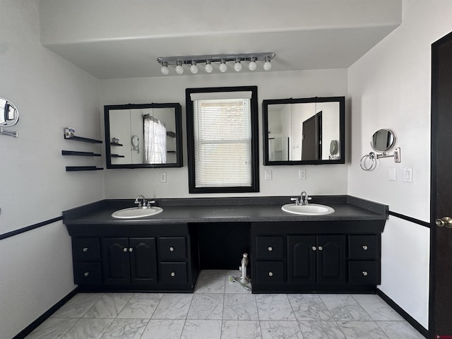 bathroom with vanity and track lighting