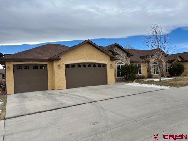 ranch-style home with a garage