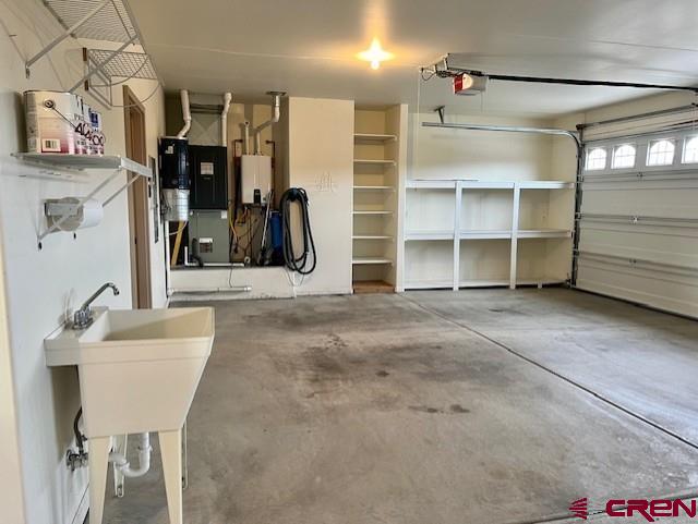 garage featuring a garage door opener and sink