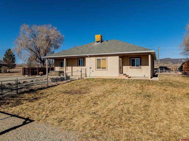 back of house with a yard