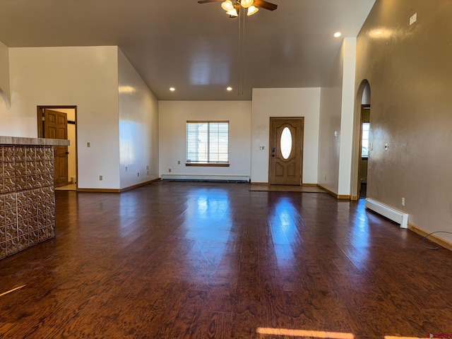 foyer entrance featuring ceiling fan, dark wood-type flooring, and baseboard heating