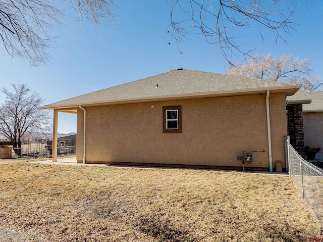 view of home's exterior with a yard