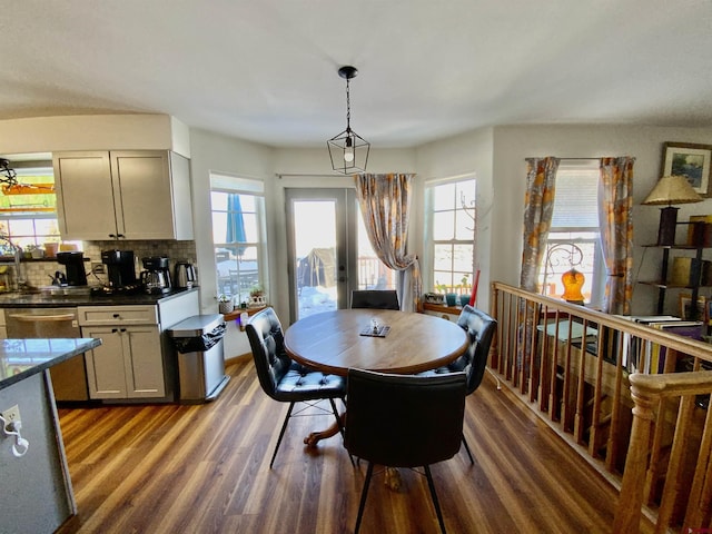 dining space featuring french doors and dark hardwood / wood-style floors