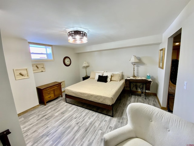 bedroom with light hardwood / wood-style floors