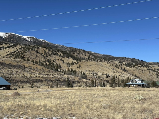 property view of mountains featuring a rural view