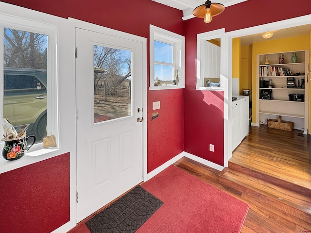 doorway with hardwood / wood-style floors