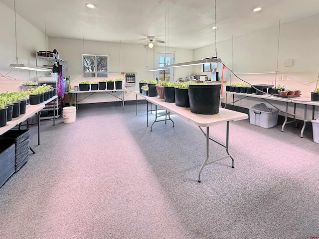 interior space featuring ceiling fan and heating unit