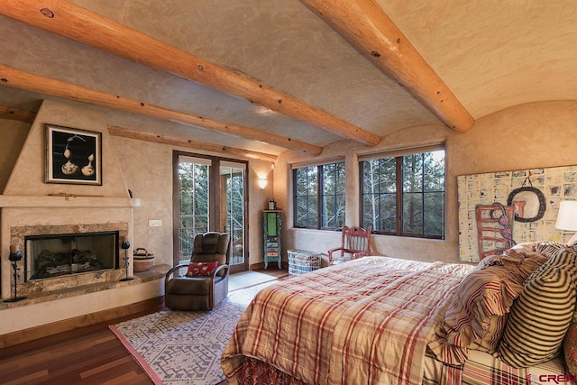 bedroom featuring french doors, wood-type flooring, lofted ceiling with beams, access to outside, and a premium fireplace