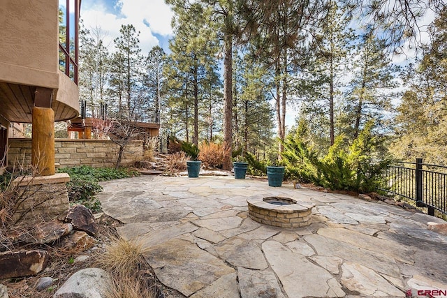 view of patio with a fire pit