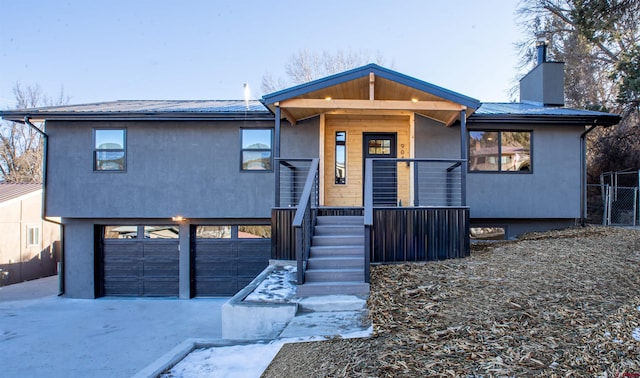 view of front of house featuring a garage and a porch