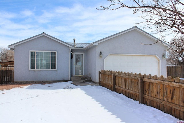 single story home featuring a garage