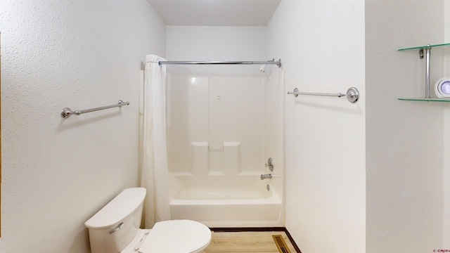 bathroom with toilet and tub / shower combination