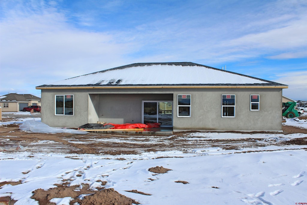 view of snow covered house