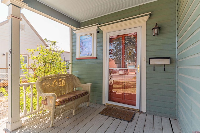 doorway to property featuring a porch