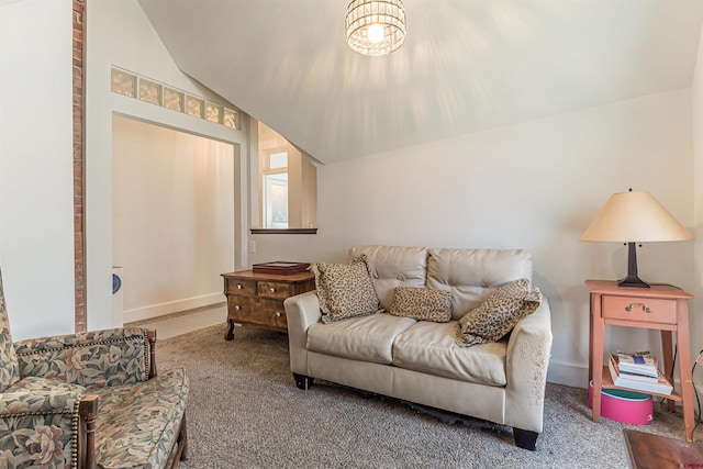 living room with lofted ceiling and carpet