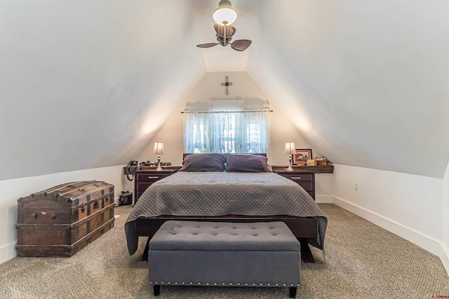 bedroom with vaulted ceiling and carpet floors