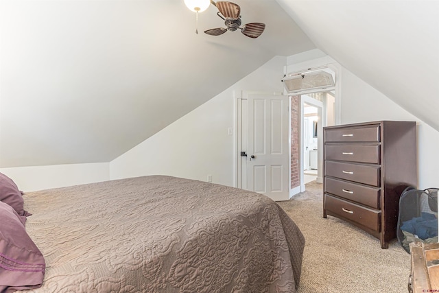 bedroom featuring vaulted ceiling and light colored carpet