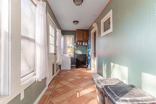 doorway with light tile patterned floors