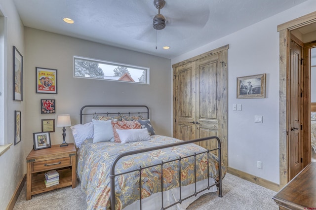 bedroom featuring ceiling fan and a closet