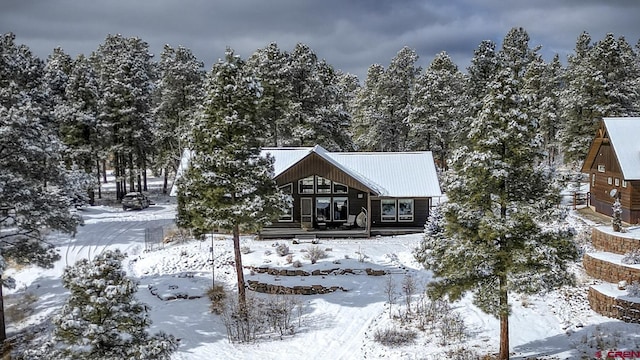 view of snow covered house