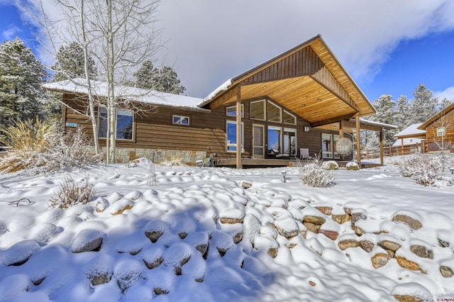 view of snow covered house