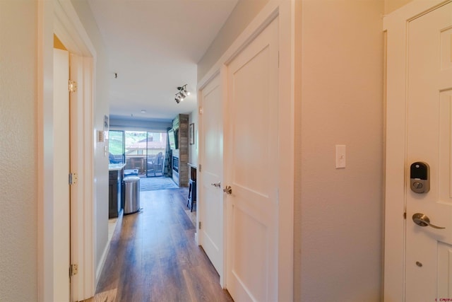 hallway featuring dark wood-style floors