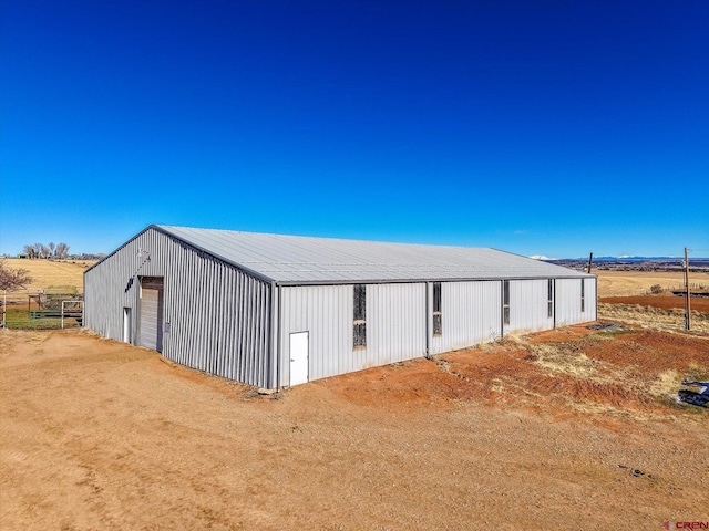 view of outbuilding featuring a rural view