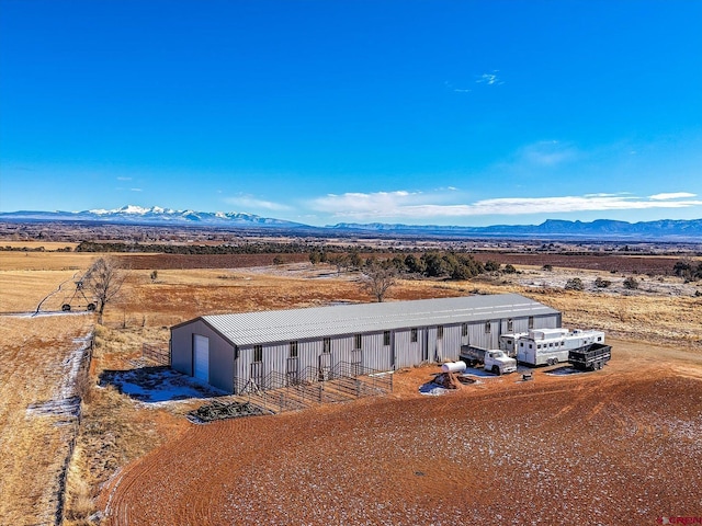 bird's eye view featuring a mountain view and a rural view