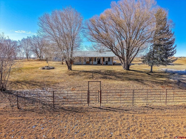 view of yard with a rural view