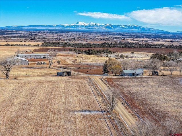 drone / aerial view with a mountain view and a rural view