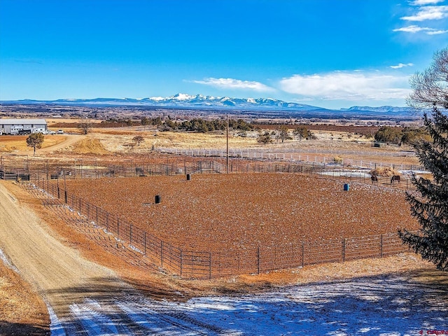 birds eye view of property featuring a rural view and a mountain view