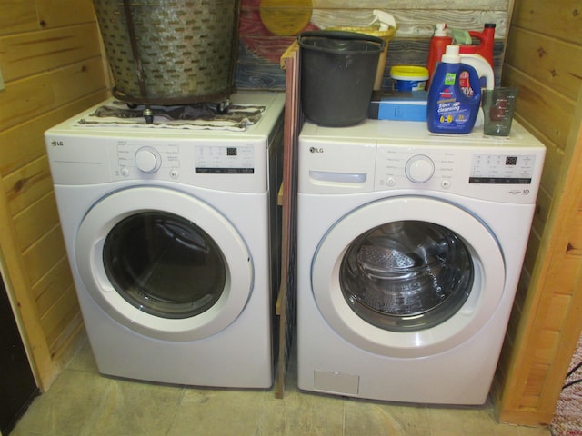 clothes washing area with washing machine and dryer