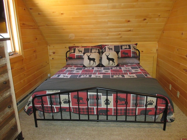 bedroom with vaulted ceiling, carpet, wood ceiling, and wood walls