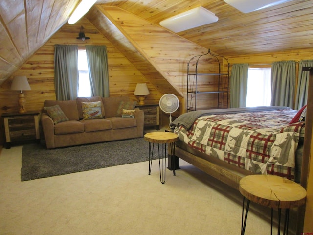 carpeted bedroom with lofted ceiling, wooden walls, multiple windows, and wooden ceiling