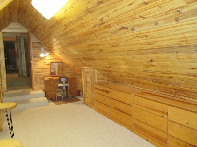 bonus room featuring lofted ceiling, wooden walls, wooden ceiling, and light carpet