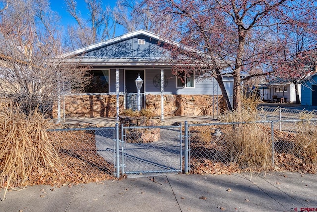 single story home featuring covered porch