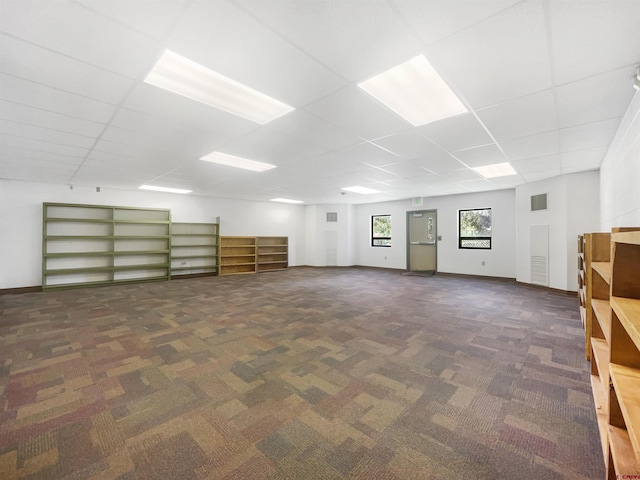 additional living space featuring dark colored carpet