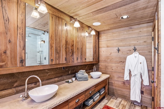 bathroom featuring hardwood / wood-style flooring, vanity, wooden ceiling, and wood walls