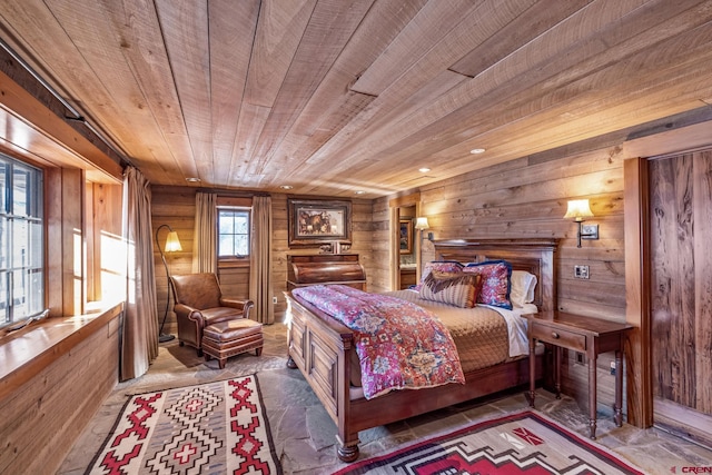 bedroom with wooden ceiling and wooden walls