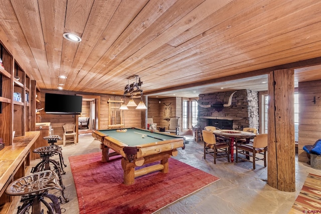 game room featuring a fireplace, wood ceiling, wooden walls, and pool table