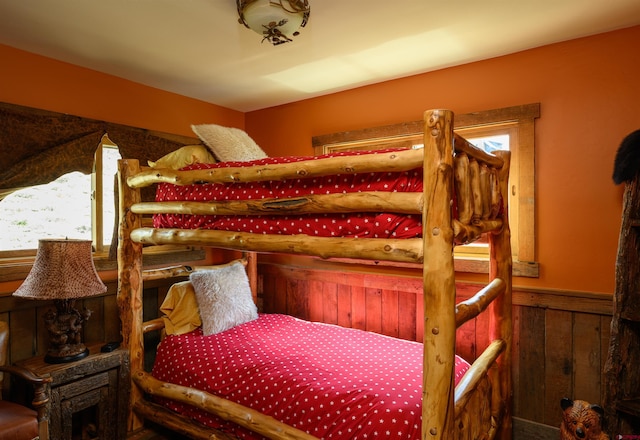 1294 County Road 734, Crested Butte, CO 81224 - carpeted bedroom featuring wainscoting and wood walls