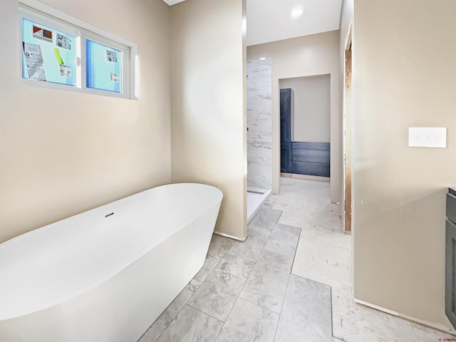 bathroom with separate shower and tub