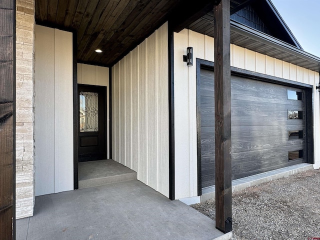 view of exterior entry with a garage