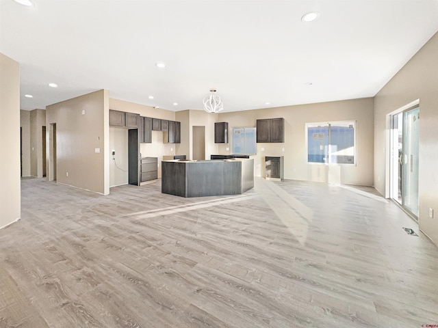 unfurnished living room with light wood-type flooring