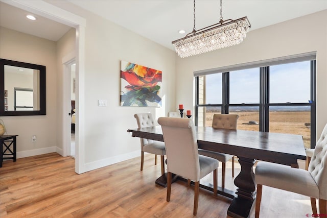 dining space with hardwood / wood-style floors