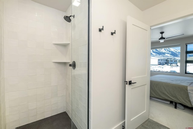 bathroom with tiled shower