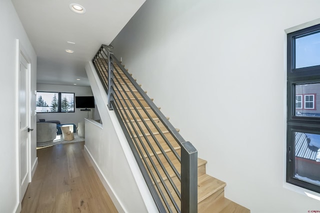 staircase featuring hardwood / wood-style flooring